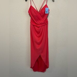 Chiffon faux-wrap dress with crossing spaghetti straps and tulip hem.